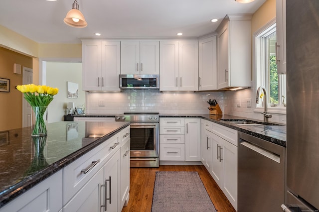 10 Oak Dr, Essex, CT 06409 - kitchen featuring stainless steel appliances, dark wood finished floors, decorative backsplash, white cabinets, and recessed lighting