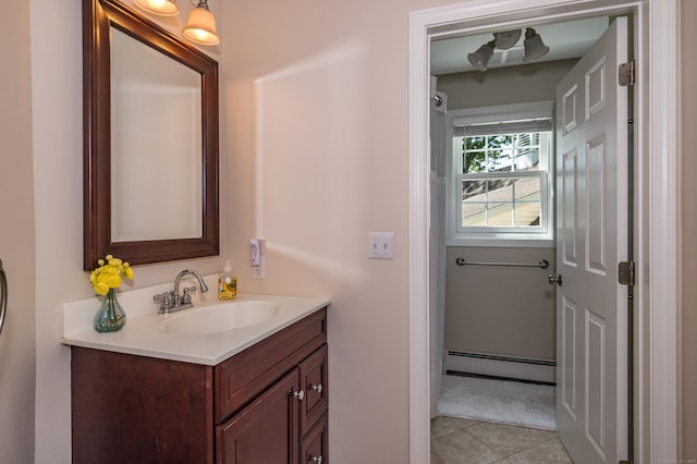 10 Oak Dr, Essex, CT 06409 - bathroom featuring a baseboard radiator, vanity, and tile patterned floors