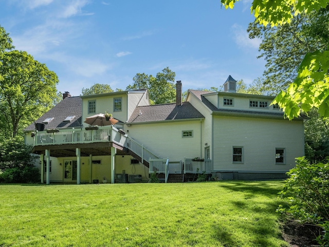 10 Oak Dr, Essex, CT 06409 - rear view of property with a wooden deck, a lawn, a chimney, and stairway