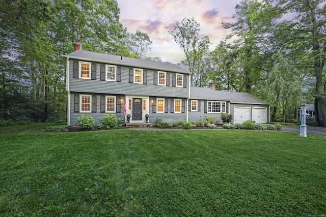 30 Clifdon Dr, Simsbury, CT 06070 - colonial inspired home featuring a chimney, asphalt driveway, an attached garage, and a front lawn
