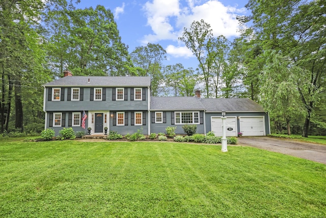 30 Clifdon Dr, Simsbury, CT 06070 - colonial house featuring a chimney, asphalt driveway, a garage, and a front lawn
