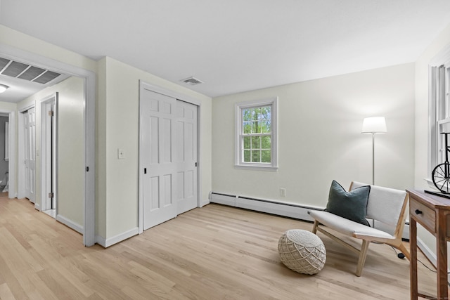 30 Clifdon Dr, Simsbury, CT 06070 - living area with baseboard heating and light wood-type flooring