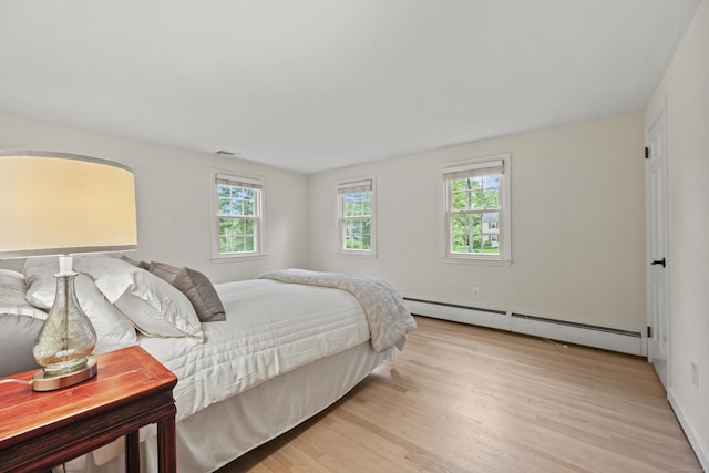 30 Clifdon Dr, Simsbury, CT 06070 - bedroom with baseboard heating and light wood-style floors
