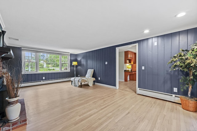 30 Clifdon Dr, Simsbury, CT 06070 - sitting room with a baseboard heating unit, wood finished floors, ornamental molding, recessed lighting, and a fireplace