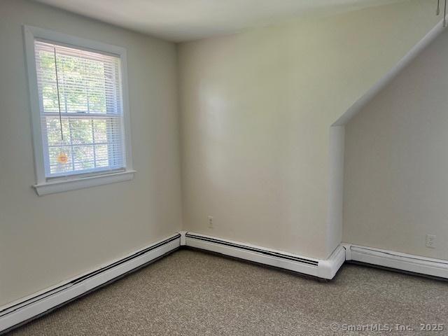 489 Adams St, Manchester, CT 06040 - empty room featuring baseboard heating and carpet floors
