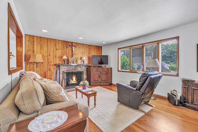 16 Senga Rd, Norwalk, CT 06854 - living area with recessed lighting, a fireplace, wood finished floors, and wooden walls