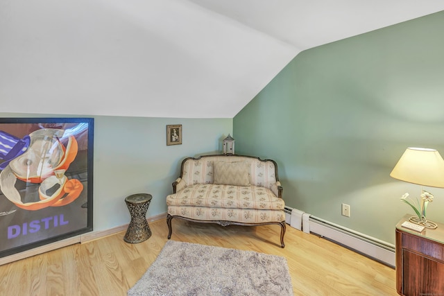 16 Senga Rd, Norwalk, CT 06854 - living area with a baseboard radiator, lofted ceiling, and wood finished floors