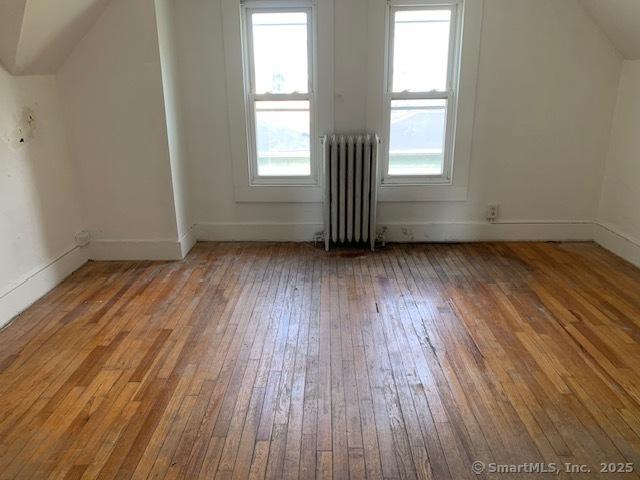 358 Orchard St, New Haven, CT 06511 - additional living space featuring radiator and hardwood / wood-style floors