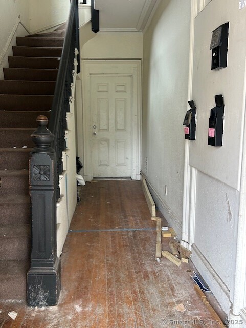 358 Orchard St, New Haven, CT 06511 - foyer featuring stairs and crown molding