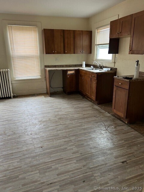358 Orchard St, New Haven, CT 06511 - kitchen with radiator and light wood finished floors