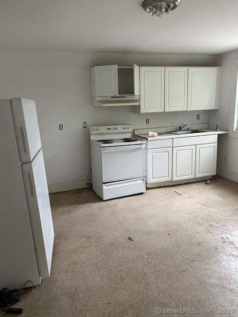 358 Orchard St, New Haven, CT 06511 - kitchen with white appliances, under cabinet range hood, white cabinetry, and light countertops