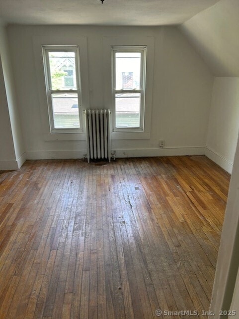 358 Orchard St, New Haven, CT 06511 - additional living space featuring radiator heating unit, hardwood / wood-style flooring, healthy amount of natural light, and lofted ceiling