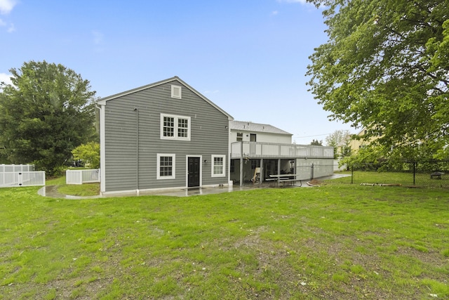 18 King St, Old Saybrook, CT 06475 - back of property with a patio area and a wooden deck