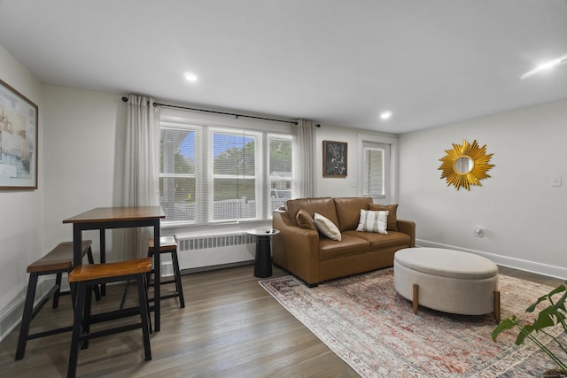 18 King St, Old Saybrook, CT 06475 - living room with radiator heating unit, wood finished floors, and recessed lighting