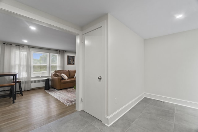 18 King St, Old Saybrook, CT 06475 - corridor with radiator heating unit, tile patterned flooring, and recessed lighting