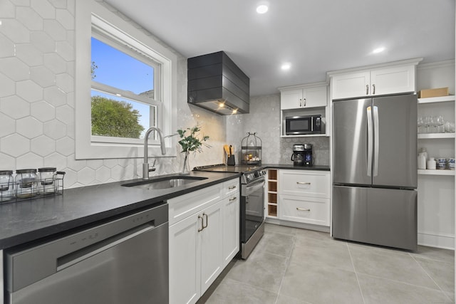 18 King St, Old Saybrook, CT 06475 - kitchen featuring stainless steel appliances, wall chimney range hood, dark countertops, decorative backsplash, and recessed lighting