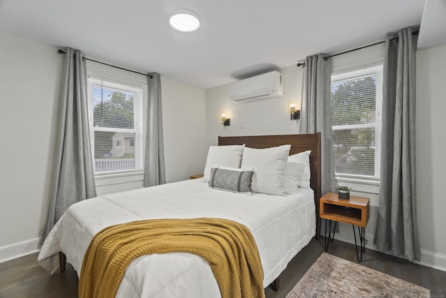 18 King St, Old Saybrook, CT 06475 - bedroom featuring a wall unit AC and dark wood finished floors