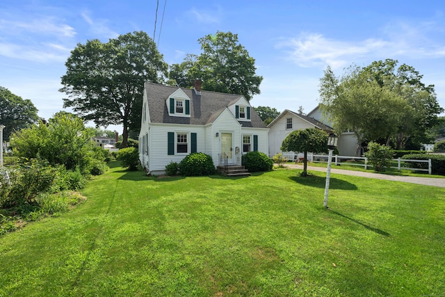 16 Lynde St, Old Saybrook, CT 06475 - view of front of home with driveway, a chimney, and a shingled roof