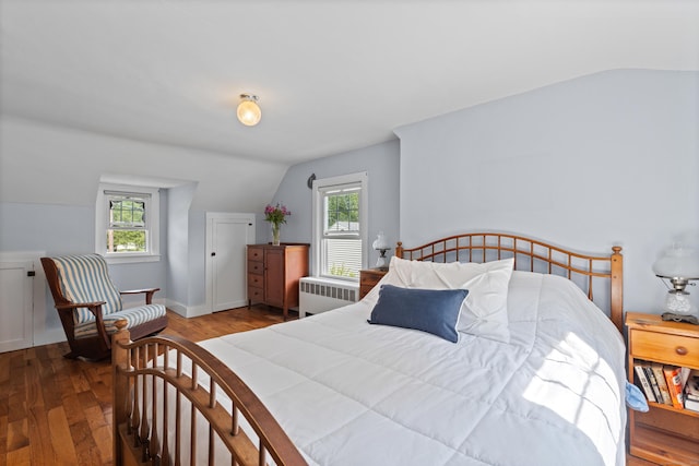 16 Lynde St, Old Saybrook, CT 06475 - bedroom featuring radiator, vaulted ceiling, and wood finished floors