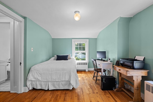 16 Lynde St, Old Saybrook, CT 06475 - bedroom with radiator heating unit, wood finished floors, vaulted ceiling, and a desk