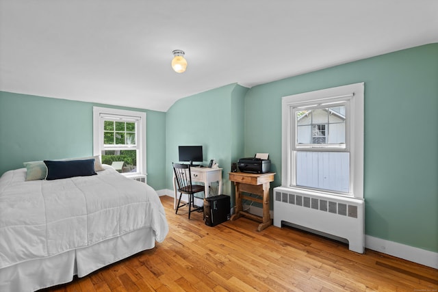 16 Lynde St, Old Saybrook, CT 06475 - bedroom with radiator, wood finished floors, and lofted ceiling