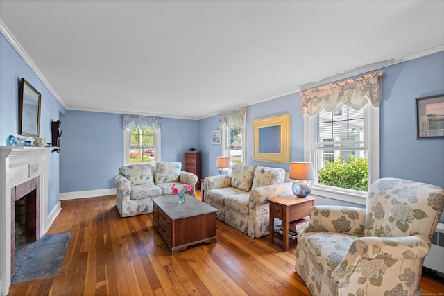 16 Lynde St, Old Saybrook, CT 06475 - living area with ornamental molding, hardwood / wood-style floors, and a brick fireplace
