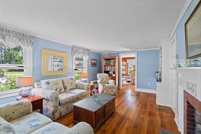 16 Lynde St, Old Saybrook, CT 06475 - living room with ornamental molding, dark wood-style flooring, healthy amount of natural light, and a fireplace