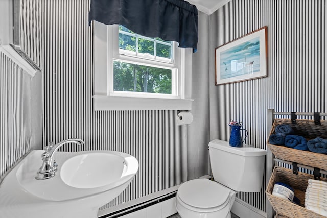 16 Lynde St, Old Saybrook, CT 06475 - half bathroom featuring baseboard heating and ornamental molding