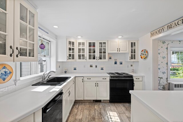 16 Lynde St, Old Saybrook, CT 06475 - kitchen featuring black appliances, light wood-style floors, white cabinetry, backsplash, and recessed lighting