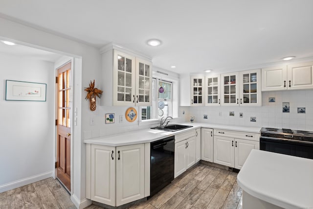 16 Lynde St, Old Saybrook, CT 06475 - kitchen featuring dishwasher, range with electric stovetop, light wood-style flooring, decorative backsplash, and recessed lighting
