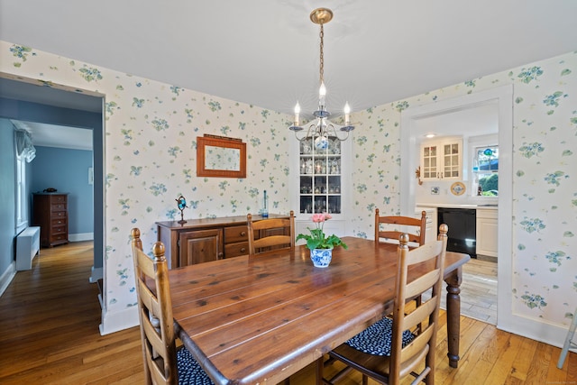 16 Lynde St, Old Saybrook, CT 06475 - dining area with wallpapered walls, light wood-style flooring, and a chandelier