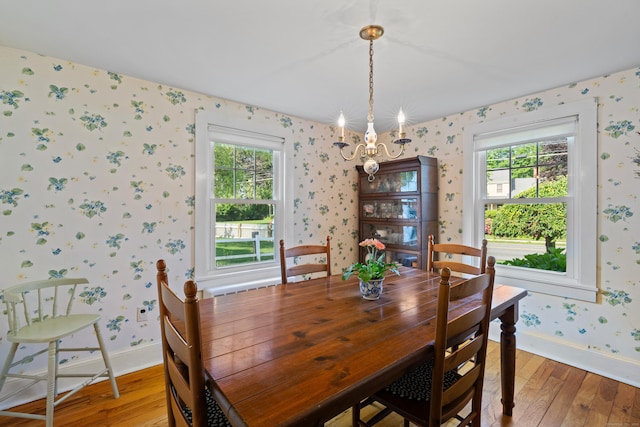16 Lynde St, Old Saybrook, CT 06475 - dining area with wallpapered walls, light wood finished floors, plenty of natural light, and a chandelier