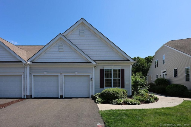 9 Meadowview Ct Unit 9, Canton, CT 06019 - view of front facade with asphalt driveway and an attached garage