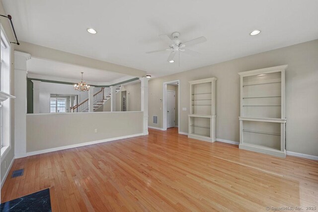 9 Meadowview Ct Unit 9, Canton, CT 06019 - unfurnished living room with ceiling fan, ornate columns, wood finished floors, a chandelier, and recessed lighting
