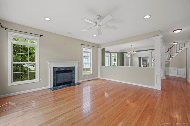 9 Meadowview Ct Unit 9, Canton, CT 06019 - unfurnished living room with healthy amount of natural light, a chandelier, a ceiling fan, light wood-style floors, and recessed lighting