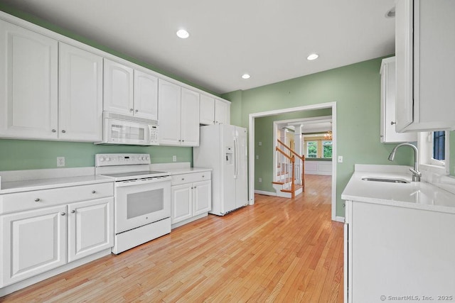 9 Meadowview Ct Unit 9, Canton, CT 06019 - kitchen with white appliances, white cabinetry, light wood-type flooring, light countertops, and recessed lighting