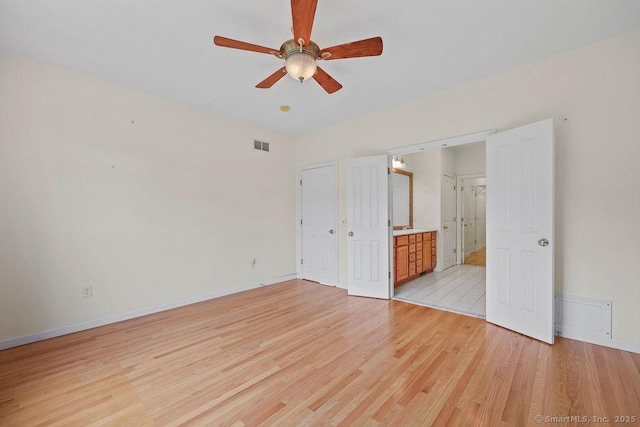 9 Meadowview Ct Unit 9, Canton, CT 06019 - unfurnished bedroom featuring light wood-type flooring, connected bathroom, and ceiling fan