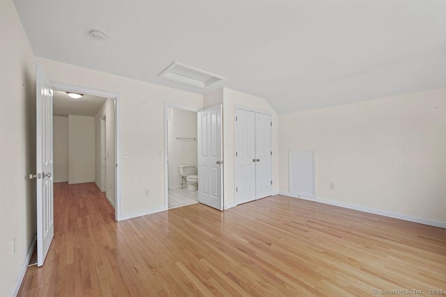 9 Meadowview Ct Unit 9, Canton, CT 06019 - unfurnished bedroom with light wood-type flooring, attic access, and ensuite bath