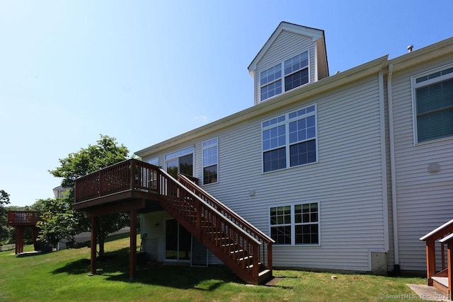 9 Meadowview Ct Unit 9, Canton, CT 06019 - rear view of property featuring stairway, a wooden deck, and a lawn