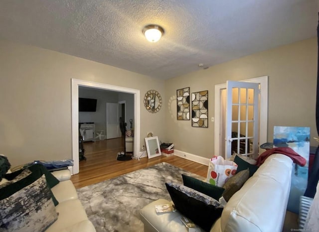 84 Love Ln, Hartford, CT 06112 - living room featuring wood finished floors and a textured ceiling
