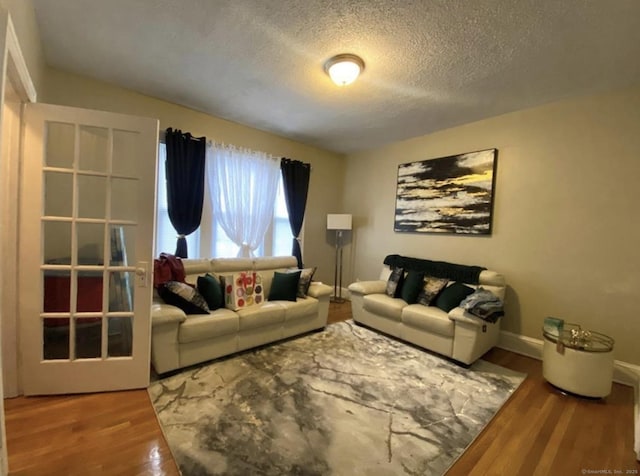 84 Love Ln, Hartford, CT 06112 - living room featuring wood finished floors and a textured ceiling