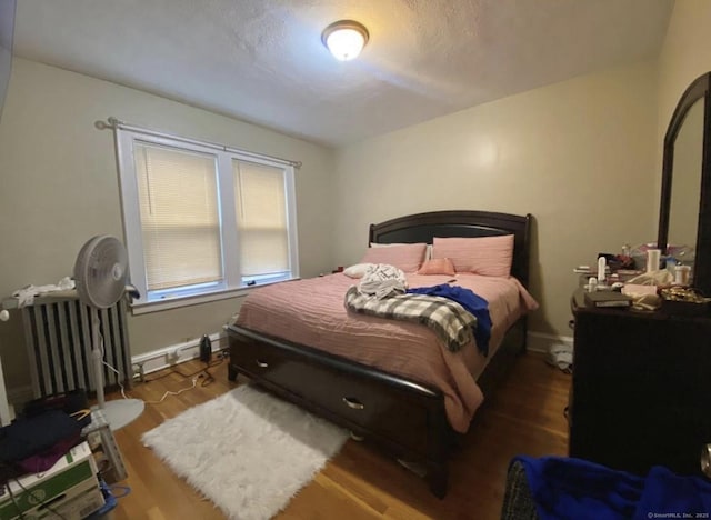 84 Love Ln, Hartford, CT 06112 - bedroom with wood finished floors and a textured ceiling