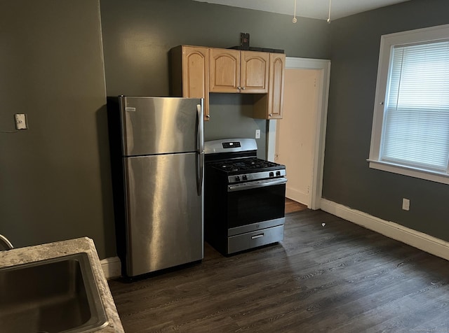 84 Love Ln, Hartford, CT 06112 - kitchen with appliances with stainless steel finishes, light brown cabinetry, dark wood-type flooring, and light countertops