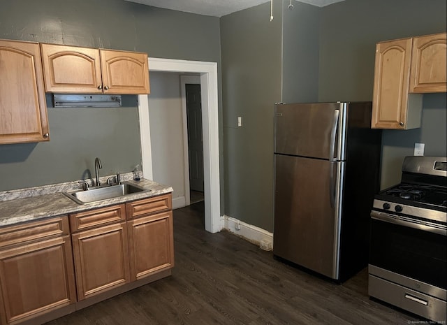 84 Love Ln, Hartford, CT 06112 - kitchen with appliances with stainless steel finishes, dark wood-type flooring, and light brown cabinetry