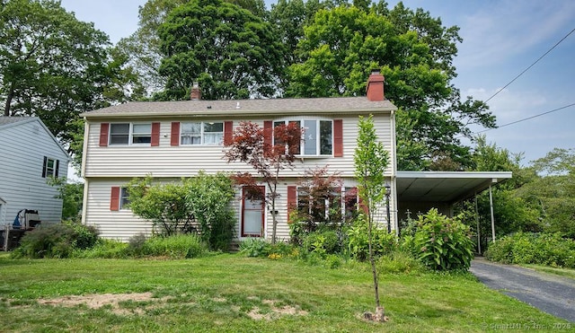 80 Easy St, Milford, CT 06460 - colonial-style house featuring a chimney, asphalt driveway, and a front lawn
