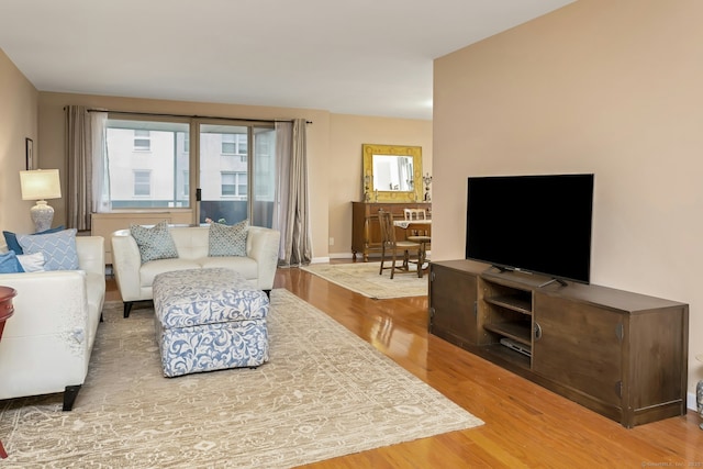 50 Glenbrook Rd Apt 7C, Stamford, CT 06902 - living room featuring wood finished floors and baseboards