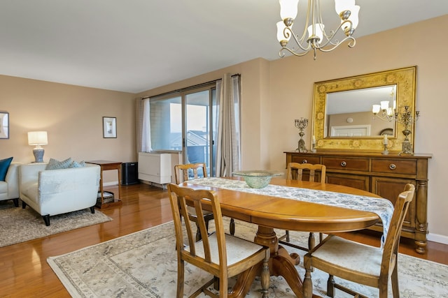 50 Glenbrook Rd Apt 7C, Stamford, CT 06902 - dining area featuring a chandelier and wood finished floors