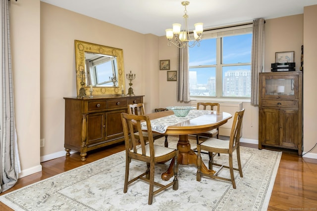 50 Glenbrook Rd Apt 7C, Stamford, CT 06902 - dining area with plenty of natural light, a chandelier, and wood finished floors