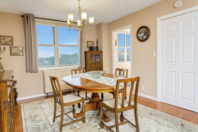 50 Glenbrook Rd Apt 7C, Stamford, CT 06902 - dining space with a chandelier and wood finished floors