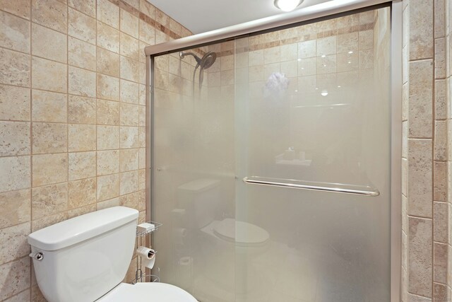 50 Glenbrook Rd Apt 7C, Stamford, CT 06902 - full bathroom with a stall shower and tile walls